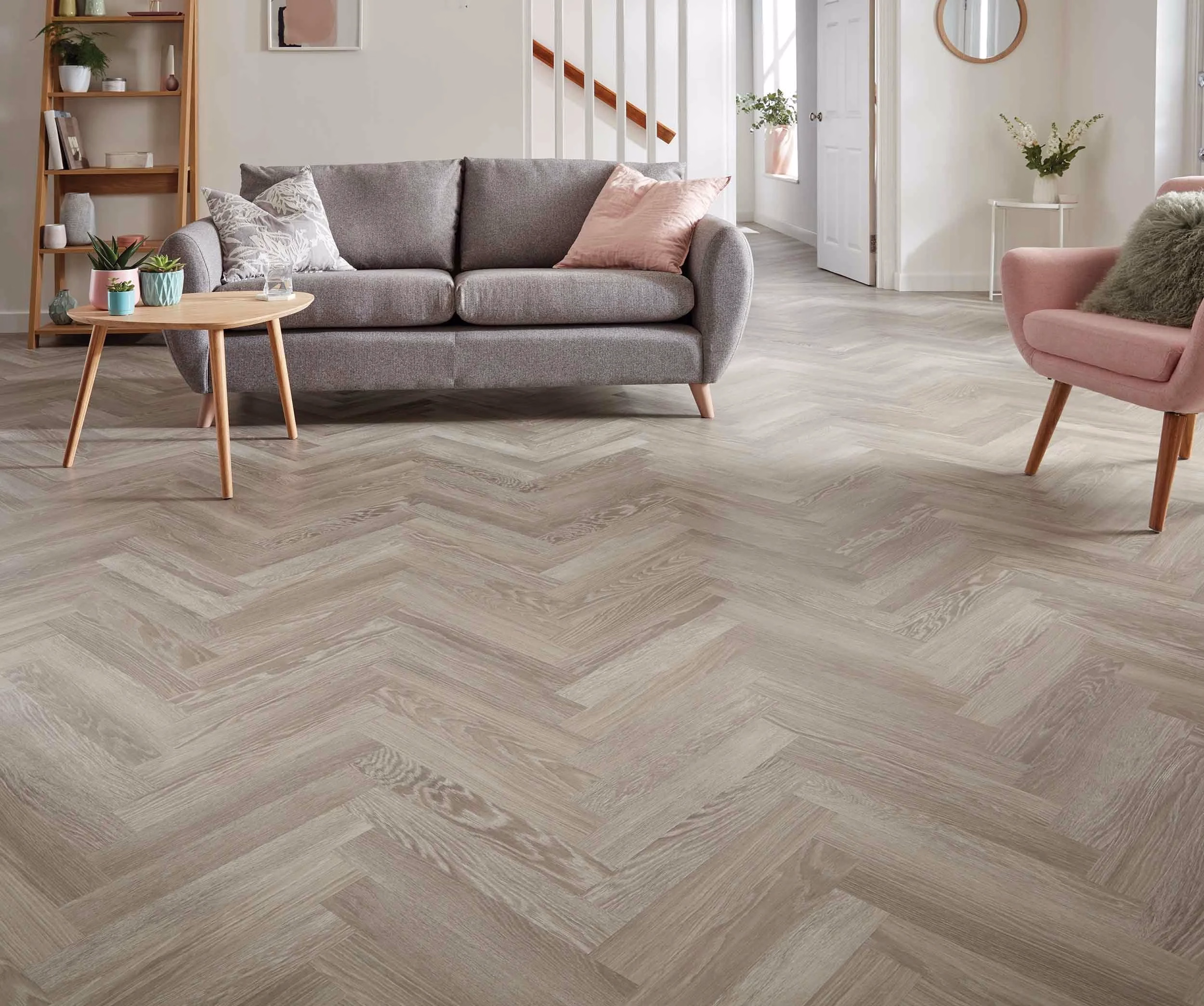 Grey limed oak herringbone flooring in a light living room