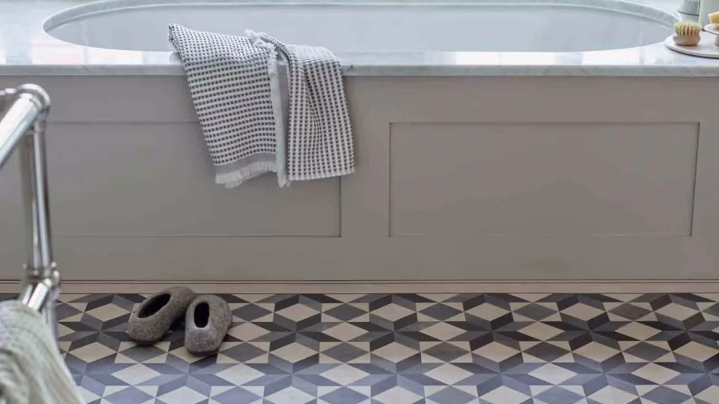 Geometric luxury vinyl flooring in a bathroom